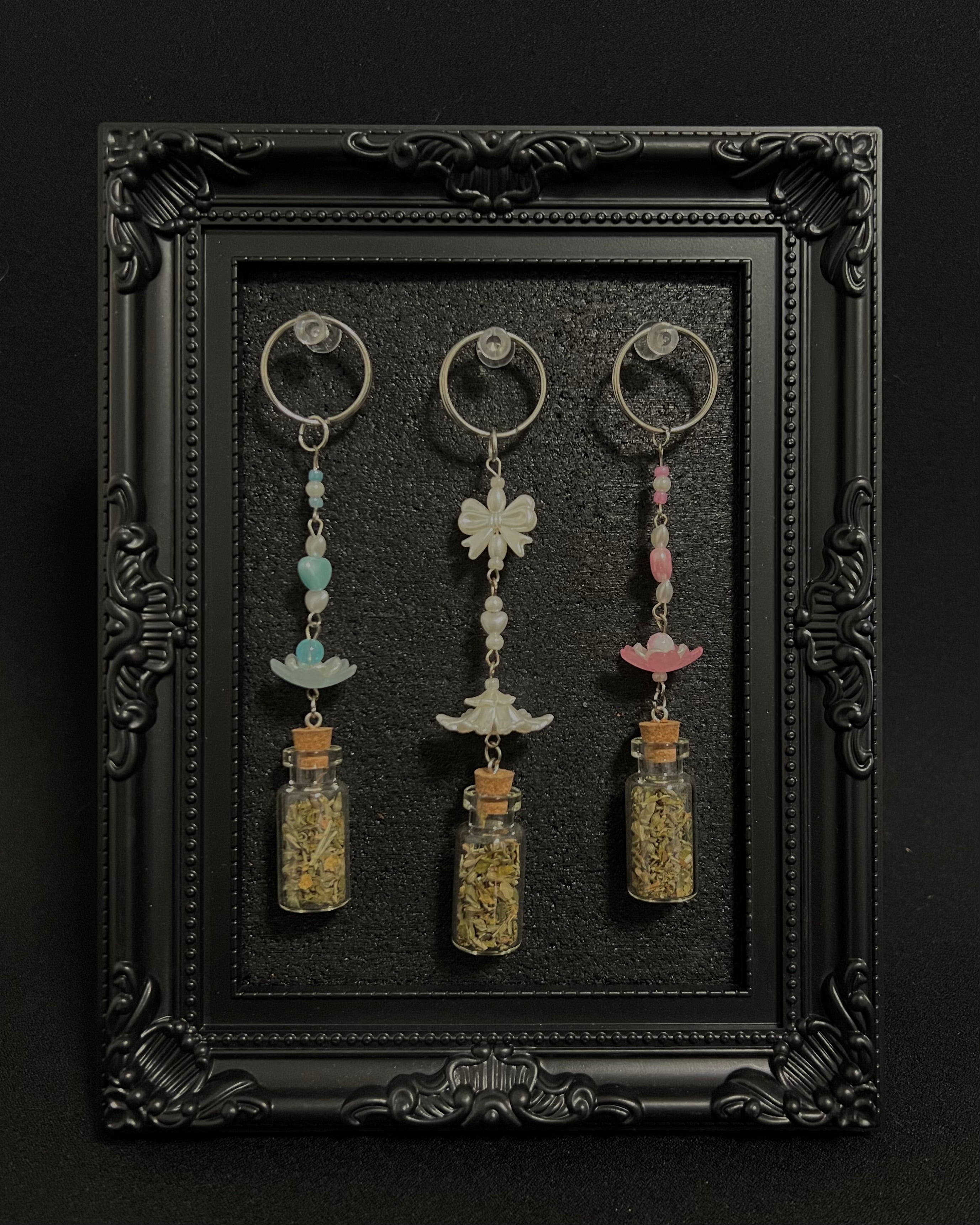 Cute Kawaii Adorable Handmade Crafted Catnip Vial Key Chains and Key Ring Charms for Feline and Cat Lovers. Can be connected to keys and or a hand bag or backpack. Coquette and Gothic Accessories for Cat Owners and Cat Lovers. 