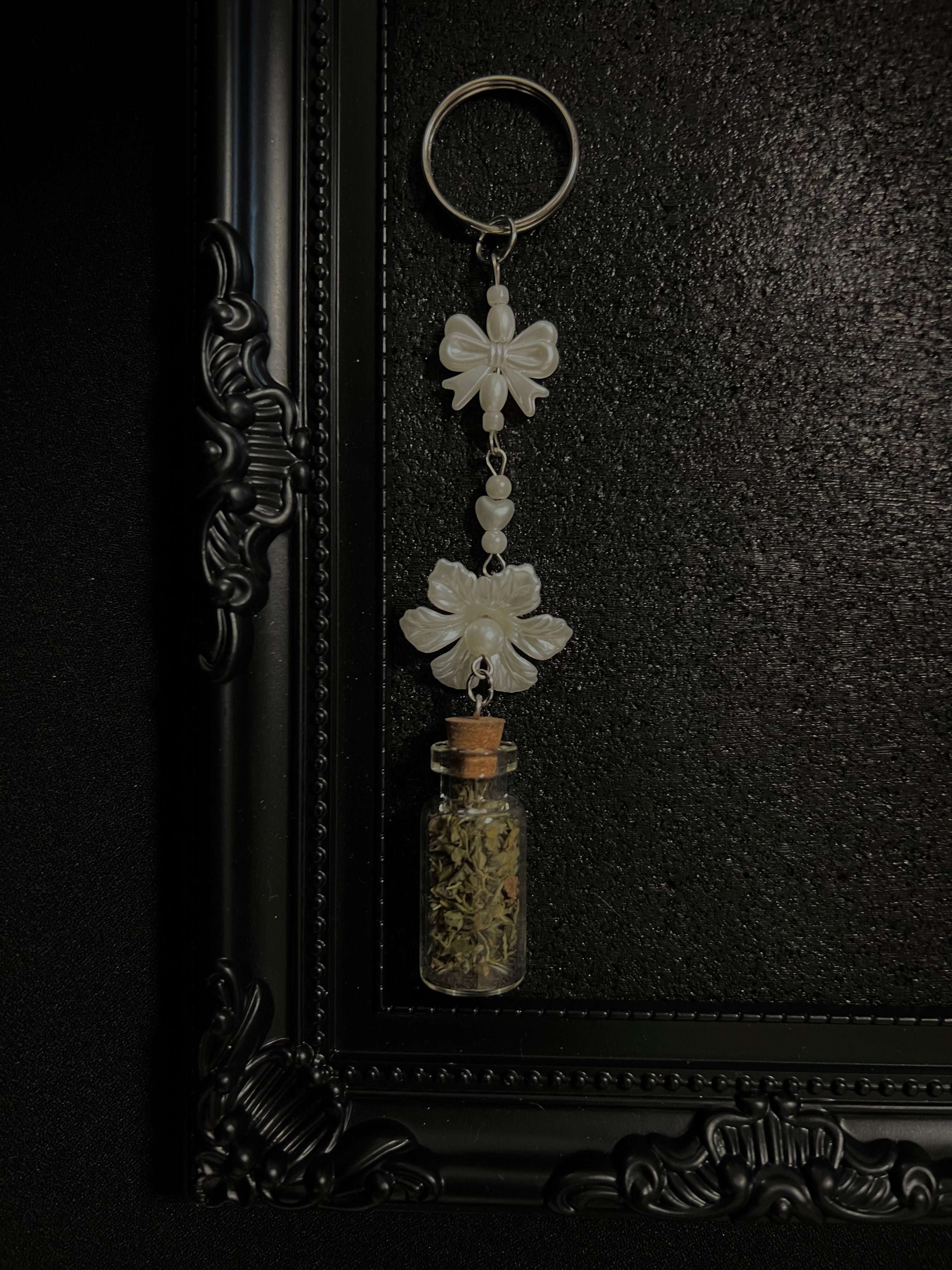 Ring Charms for Feline and Cat Lovers. Can be connected to keys and or a hand bag or backpack. Coquette and Gothic Accessories for Cat Owners and Cat Lovers. White Pearlescent Flower and Pearl Bow 